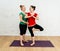 Happy attractive Yoga teacher teaching young woman Yoga at home in women healthy lifestyle