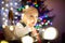 Happy baby boy playing with Chistmas lights in a cozy living room on Christmas eve. Celebrating Xmas at home. Winter evening with