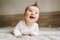 Happy baby crawling in bedroom family lifestyle smiling laughing child