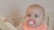 Happy baby, Cute red-haired girl, Adorable baby cuddles in a crib. close-up.slow motion video