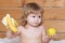 Happy baby kid eats apples and banana.