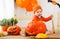 Happy baby with pumpkin for Halloween