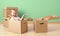 Happy baby toddler sitting in a cardboard box