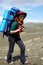 Happy backpacker woman in hat