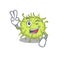 Happy bacteria coccus cartoon design concept with two fingers