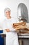 Happy Baker Holding Bread Waste In Bakery