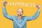 Happy bald guy office worker glad to win, smiles, laughs and raised his hands on an isolated background