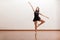 Happy ballet dancer in a studio