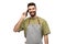 Happy barman in apron calling on smartphone