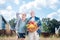 Happy beaming couple feeling amazing holding basket with their vegetables