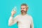 Happy beard man drinking water. Male drinking from a glass of water. Health care concept, lifestyle, close up. Smiling