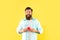 happy bearded guy drink morning coffee show thumb up on yellow background, morning