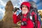 happy bearded man traveler with hiking equipment on mountain landscape background. nature hikes in the mountains