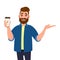 Happy bearded trendy man holding a coffee cup and pointing, showing or presenting hand palm to copy space side away.