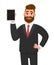 Happy bearded young business man showing/holding blank screen of a new tablet computer display and posing hand on hip. Modern.