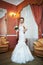 Happy beautiful bride in interior wedding palace