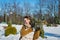 Happy beautiful bride in a snowy winter day. Sunny weather. stylish. with the wedding bouquet made from pine-tree hand made. mitte