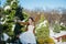 Happy beautiful bride in a snowy winter day. Sunny weather. stylish. with the wedding bouquet made from pine-tree hand made. mitte