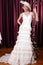 Happy beautiful brunette bride with hat and veil