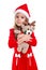 Happy beautiful christmas girl hugging the deer soft toy, wearing a santa hat isolated over a white background