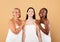 Happy Beautiful Different Multicultural Ladies Wrapped In Towels Posing Over Beige Background