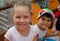 Happy beautiful little girl and little boy portrait outdoors