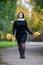 Happy beautiful woman in autumn, cute plus size model outdoors, full length portrait