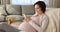 Happy beautiful young pregnant woman using cellphone.