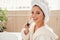 Happy beautiful young woman in cozy bathroom with with toothbrush in the hand. Beauty and healt care concept.