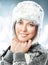 Happy beautiful young woman in fur cap