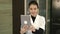 Happy beauty salon manager taking selfies with her tablet at the reception desk