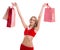 Happy beautyful woman in red santa claus clothes with shopping bags