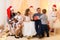 Happy big family portrait, celebrating new year or Christmas - parents and children in home interior decorated with holiday lights