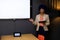 Happy biracial casual businesswoman with blue afro making presentation at whiteboard with copy space