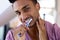 Happy biracial man brushing teeth in bathroom, smiling