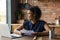 Happy biracial woman read good news in paper letter