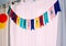 Happy birthday banner party background against white curtains and natural light