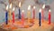 Happy birthday cake with burning colorful candles, anniversary celebration