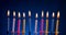 Happy birthday candles over blue