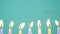 Happy Birthday concept Made of Burning Colorful Candles on blue or turquoise background. Blowing out 7 years anniversary