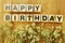Happy birthday day alphabet wooden cube on wooden background