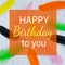 Happy Birthday Greeting Card. Happy birthday lettering. Creative greeting card with bright colored feathers. Flat lay