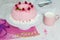 happy birthday Gugelhupf cake with pink buttercream and raspberries