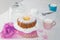 Happy birthday Gugelhupf cake with powdered sugar and blossom