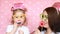 Happy birthday. Mother and daughter dress glasses and lips and different decorations to celebrate the holiday. The