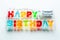 Happy Birthday sign made of letter lights on white background