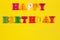 Happy birthday slogan template with copy space for text with name on bright yellow background. Greeting Birthday card