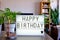 Happy Birthday written with cinema letters on a lightbox.