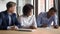 Happy black couple sign contract at realtor office