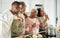 Happy black family having fun cooking together in modern kitchen